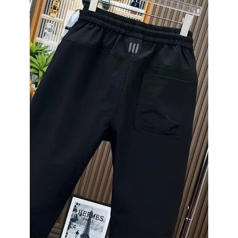 Spring new men's outdoor work pants loose fitting and trendy brand quick drying harem pants elastic waisted casual pants