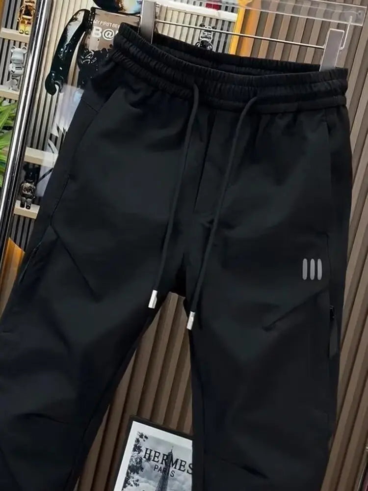 Spring new men's outdoor work pants loose fitting and trendy brand quick drying harem pants elastic waisted casual pants