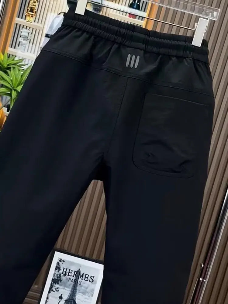 Spring new men's outdoor work pants loose fitting and trendy brand quick drying harem pants elastic waisted casual pants